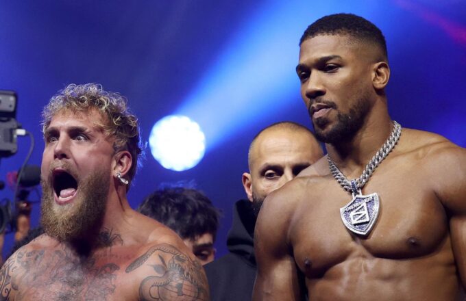 Jake and Anthony posing for the cameras before the fight, one with a serious attitude and the other with striking euphoria