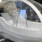 A human washing machine resembling an egg-shaped capsule