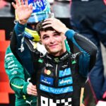 Lando looking up as he celebrates his long-awaited triumph