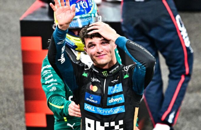 Lando looking up as he celebrates his long-awaited triumph