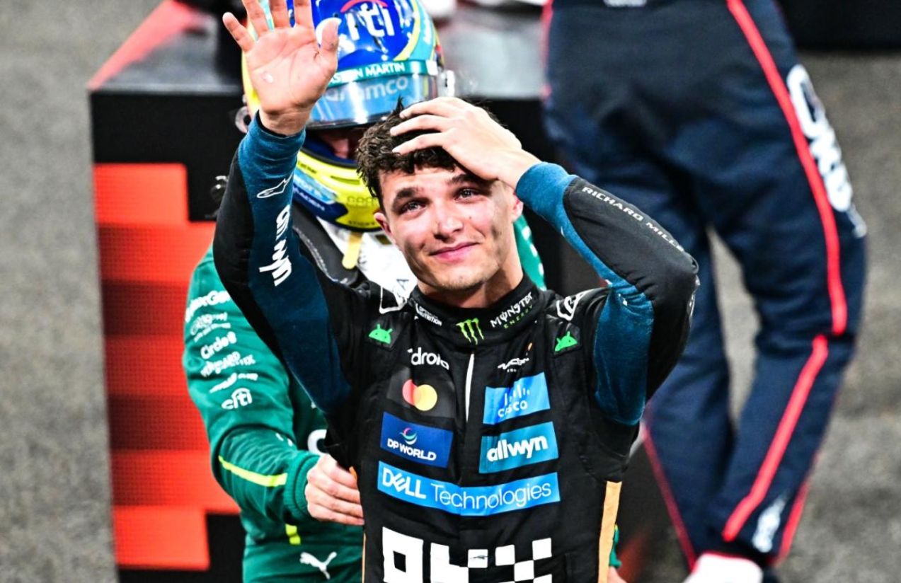 Lando looking up as he celebrates his long-awaited triumph