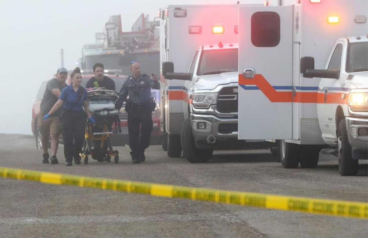 Several ambulances receiving the injured from the plane crash