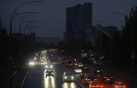 A Ukrainian city in total darkness, with the only lights coming from the cars