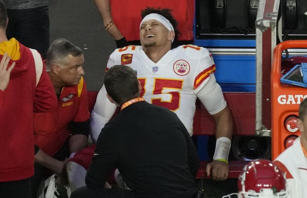 Patrick Mahomes being carried on a stretcher showing signs of pain