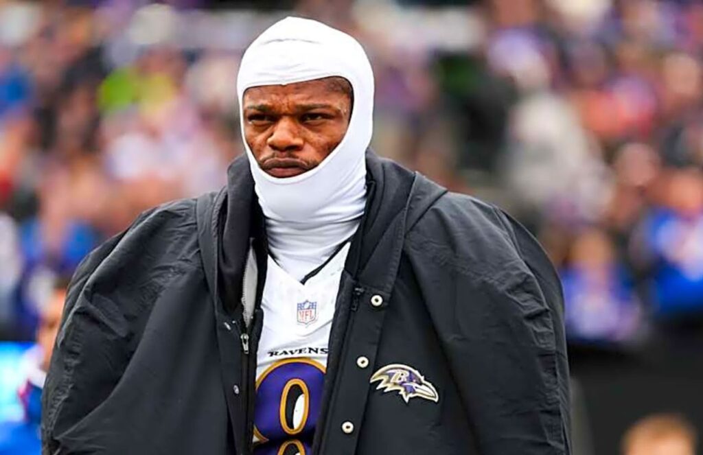 Ravens rule out Lamar Jackson for a crucial game of the season The leader of the Ravens’ offense wearing his white uniform with a large coat over it as he walks toward the locker room
