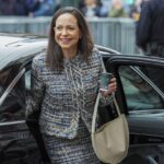 The Venezuelan politician getting out of a car wearing a beautiful black-and-white dress