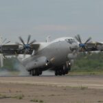 A giant Russian airplane waiting on the runway to take off
