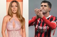 On one side, the beautiful actress wearing a stunning elegant dress, and on the other, the famous soccer player wearing his AC Milan uniform