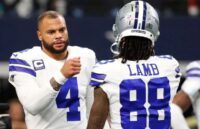 The famous Dallas quarterback greeting one of his teammates after performing well