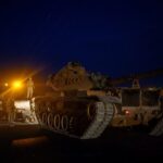 Several tanker trucks lined up, heading toward an attack in Syria