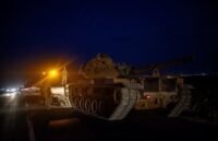 Several tanker trucks lined up, heading toward an attack in Syria