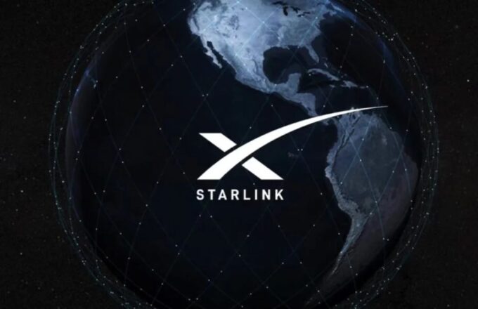 An image of the Earth with many satellites surrounding it, and in the center the word “Starlink” along with the SpaceX logo