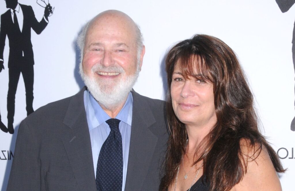 The director and his wife posing on the red carpet for all the cameras
