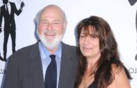 The director and his wife posing on the red carpet for all the cameras