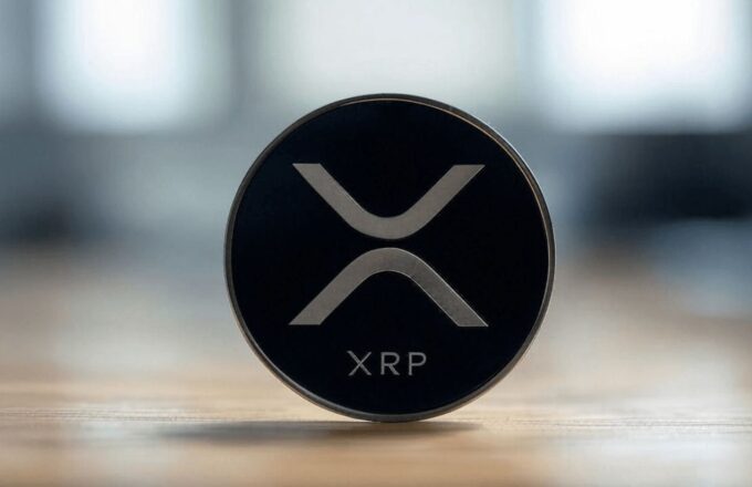 The XRP logo, which is an X, on a table