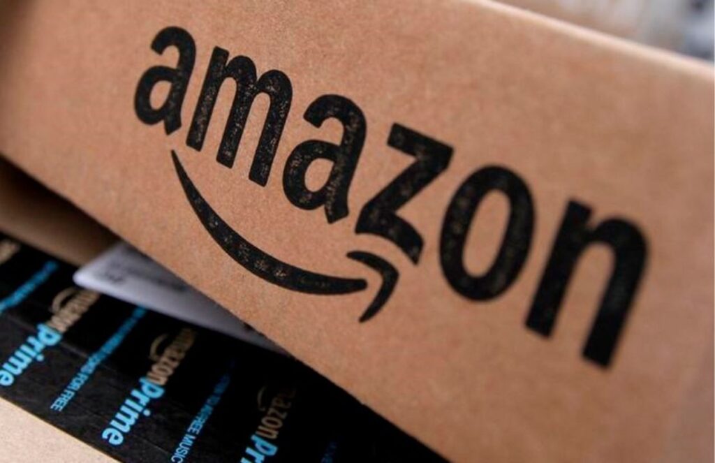 An Amazon cardboard box with its logo in black and several products from the same company inside