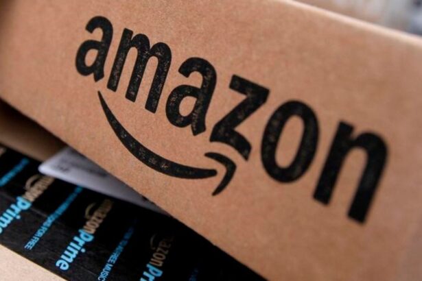 An Amazon cardboard box with its logo in black and several products from the same company inside