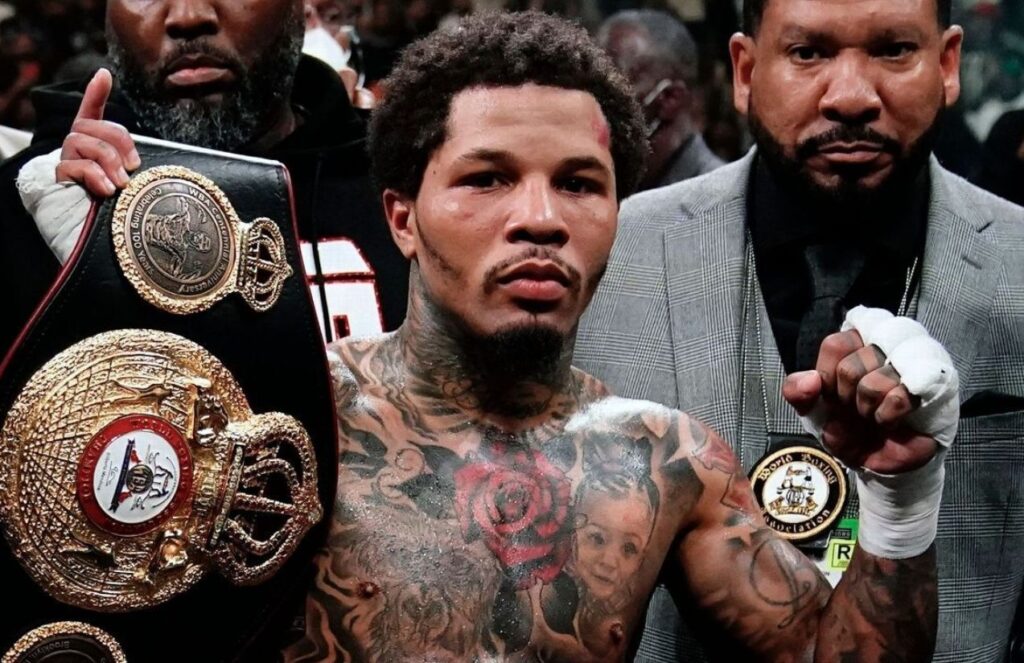 The American boxer raising a championship belt with a very serious expression