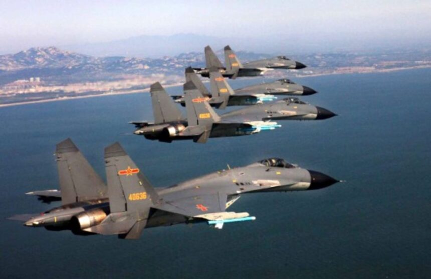 Four Chinese warplanes flying across the sky, all heading in the same direction