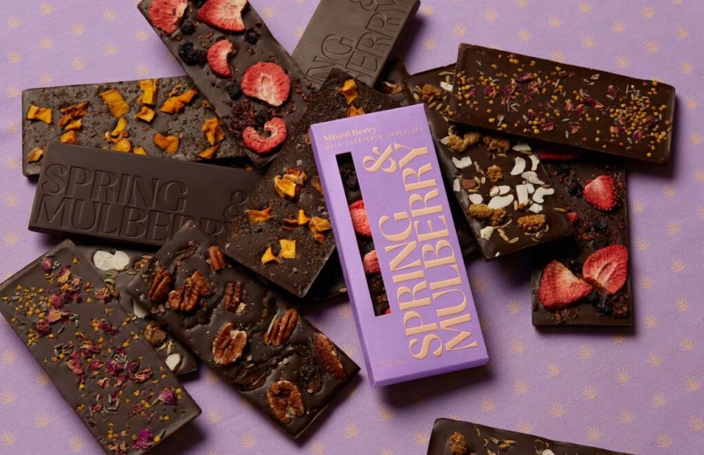 Several chocolate bars on a pink background