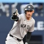 Bellinger celebrating with his teammates after hitting a base hit during a game