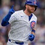 Kyle running the bases after hitting a home run while wearing the Chicago Cubs uniform