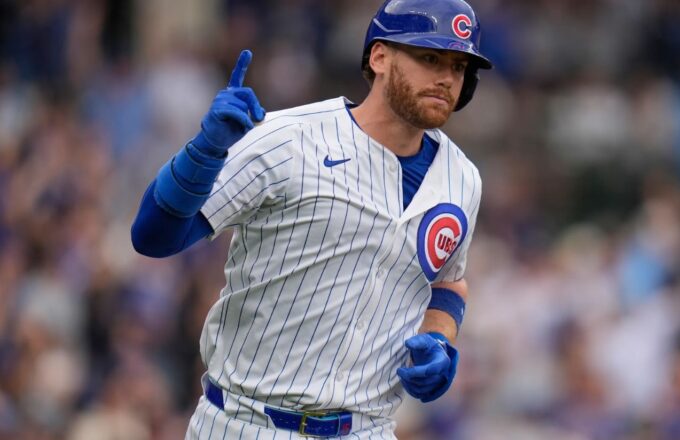 Kyle running the bases after hitting a home run while wearing the Chicago Cubs uniform