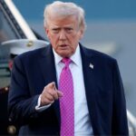 Donald Trump pointing with his finger and wearing an unfriendly expression