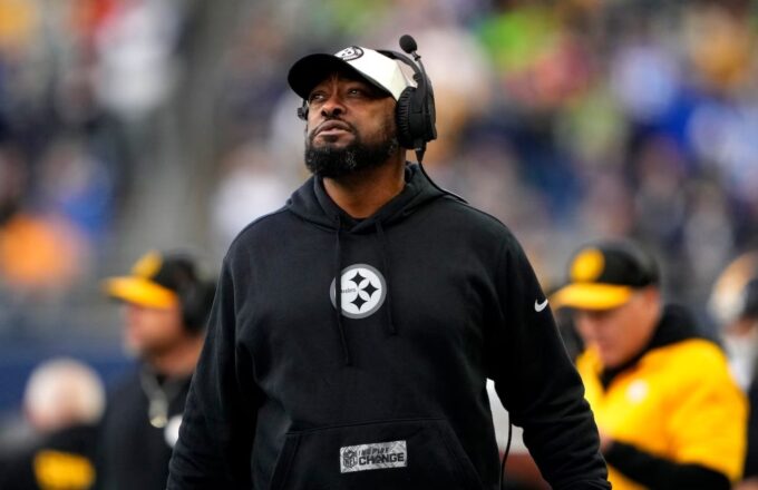 The current Steelers coach walking along the sideline with a defiant attitude