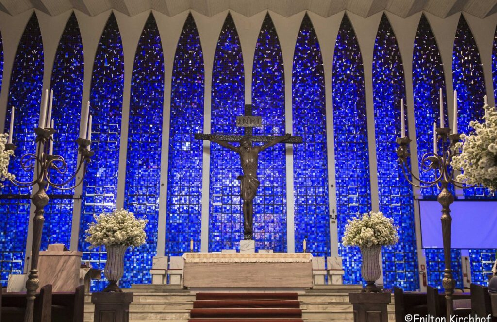 A church viewed from the inside with very large blue-colored views