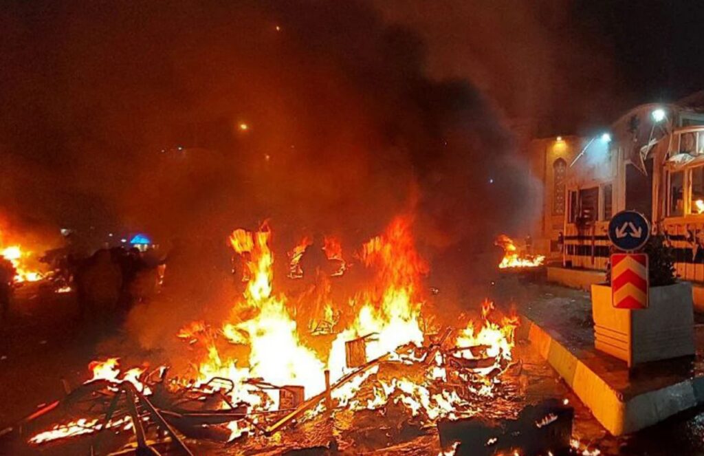 The streets of Iran filled with protesters, with cars and motorcycles consumed by fire