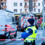 Police officers and emergency responders outside the bar where the tragedy occurred in Switzerland