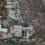 An aerial view of what happened in the Philippines, showing a massive garbage landslide and numerous emergency vehicles surrounding the area