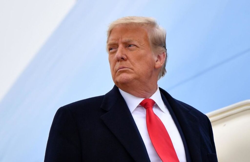 Donald Trump with a very serious expression, looking to one side