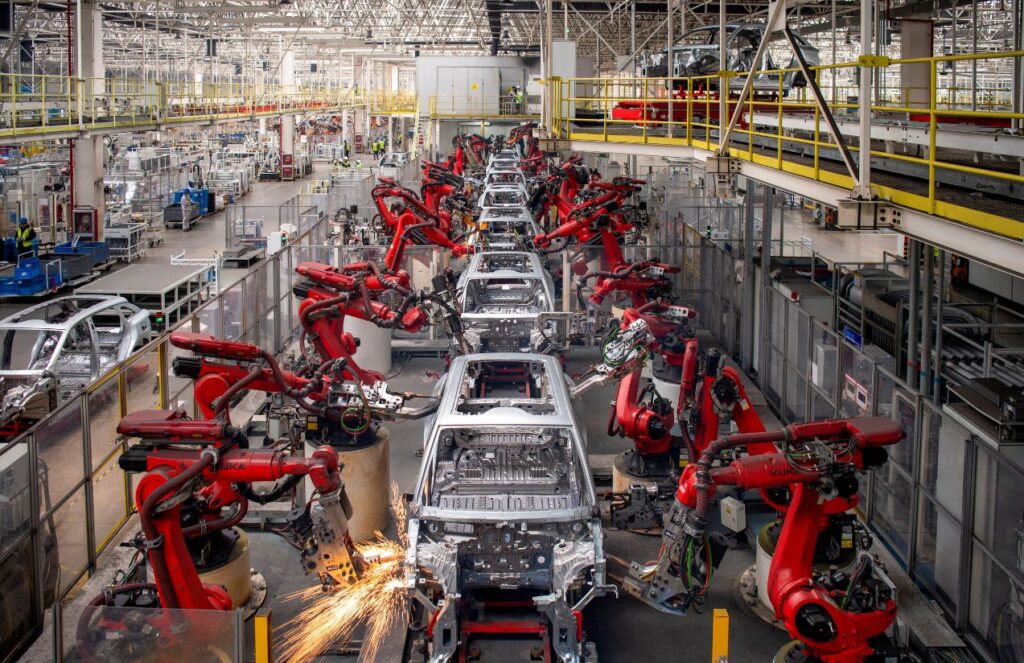 An automated car factory assembling vehicles without any human workers