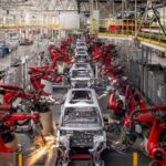 An automated car factory assembling vehicles without any human workers