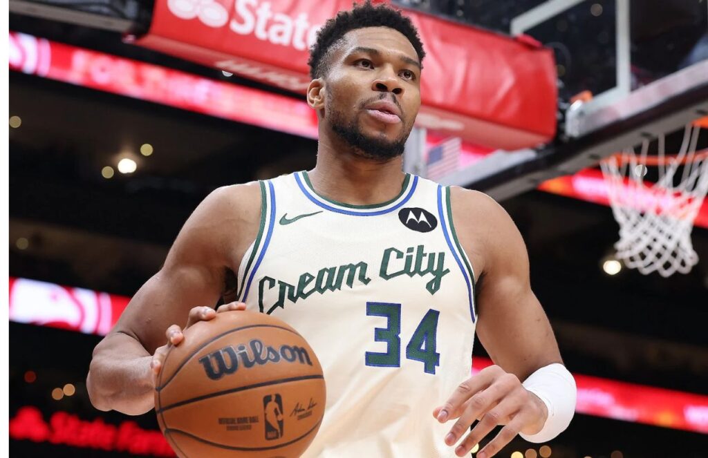 The Greek Freak holding the basketball to inbound the ball in the middle of a game