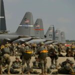 Hundreds of soldiers waiting to board multiple aircraft to depart for their new destination