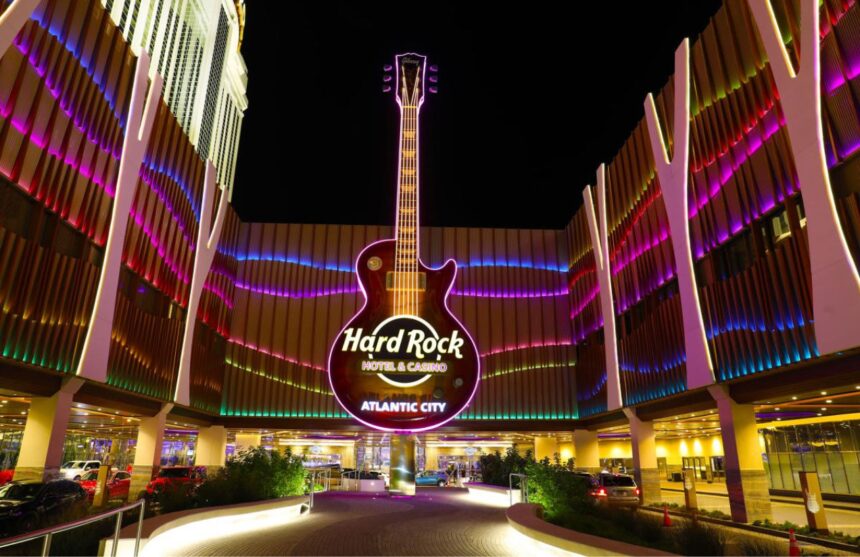 A panoramic view of the incredible hotel from the outside, featuring its iconic guitar-shaped structure