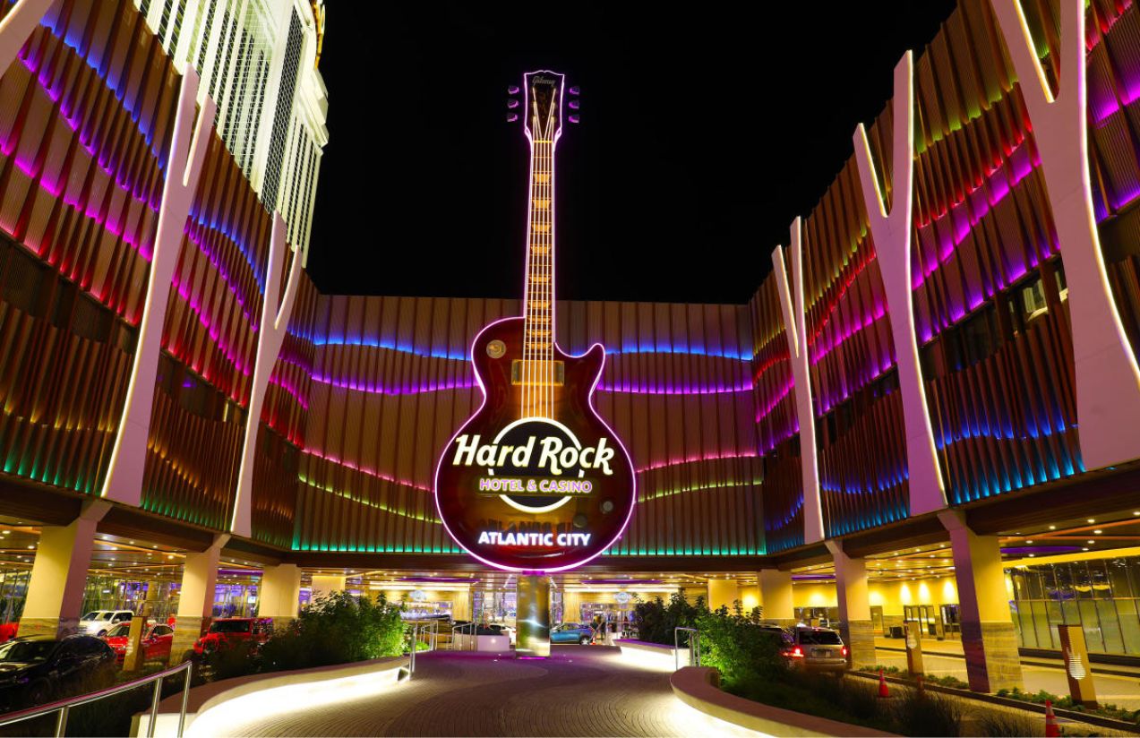 A panoramic view of the incredible hotel from the outside, featuring its iconic guitar-shaped structure