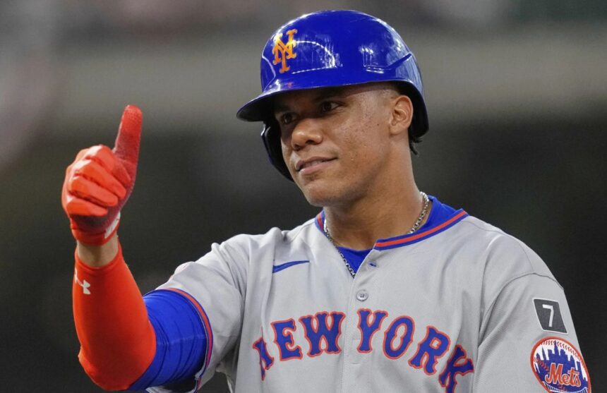 The powerful Dominican hitter smiling after a hit and reaching base