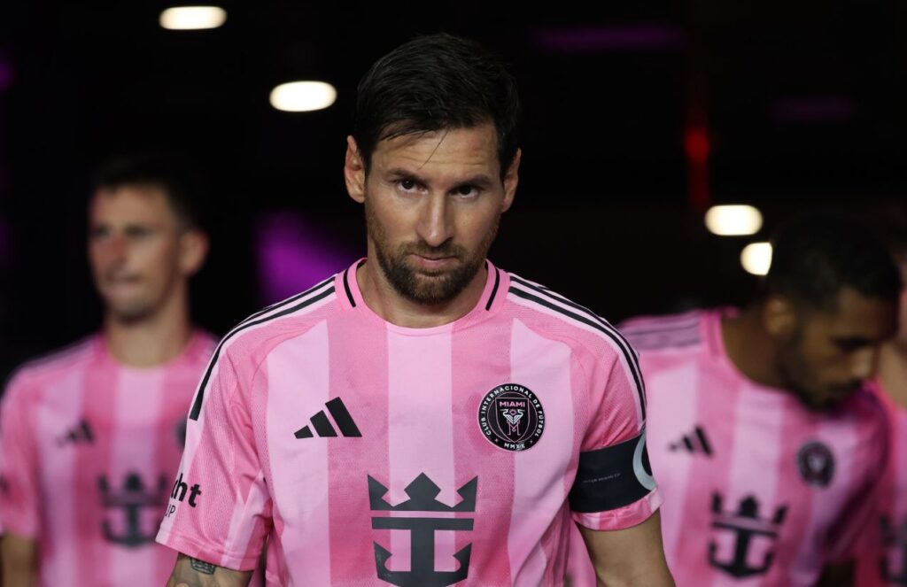 Messi returns to MLS with the 2026 World Cup on the horizon Messi walking out of the players’ tunnel heading to a match, with two of his teammates behind him