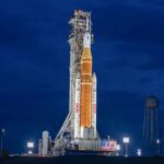 A rocket on the horizon preparing to launch into outer space