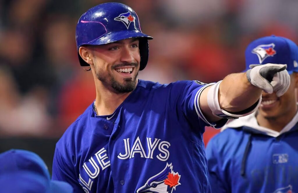 The now Yankees player happily celebrating an important home run or run with his former teammates