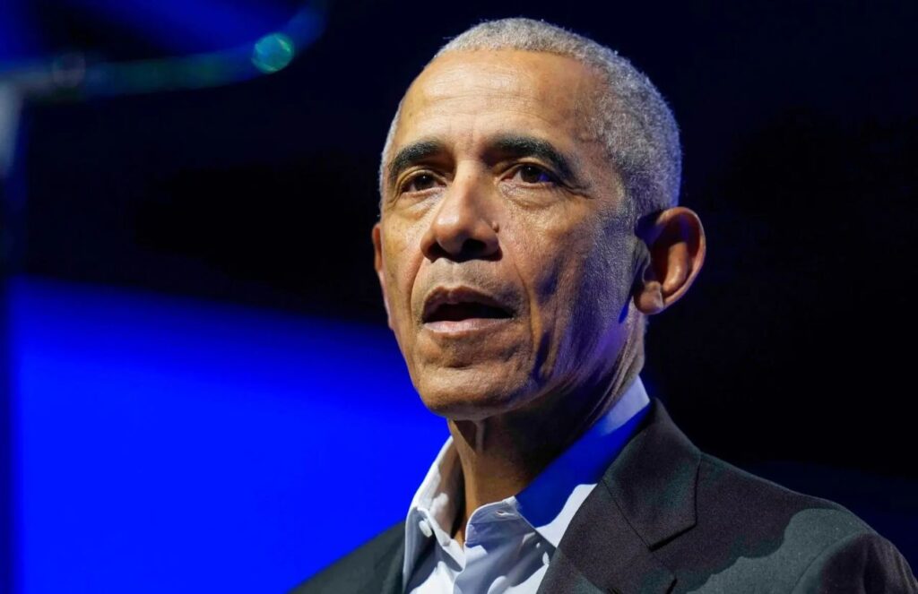 Obama compares ICE operation in Minnesota to dictatorship practices Obama wearing an elegant suit at a major event, speaking to an audience that has his full attention