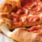 A pepperoni pizza with a cheese-stuffed crust