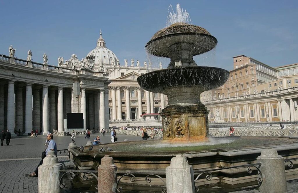 A beautiful panoramic view of St. Peter’s Square with some visitors in it