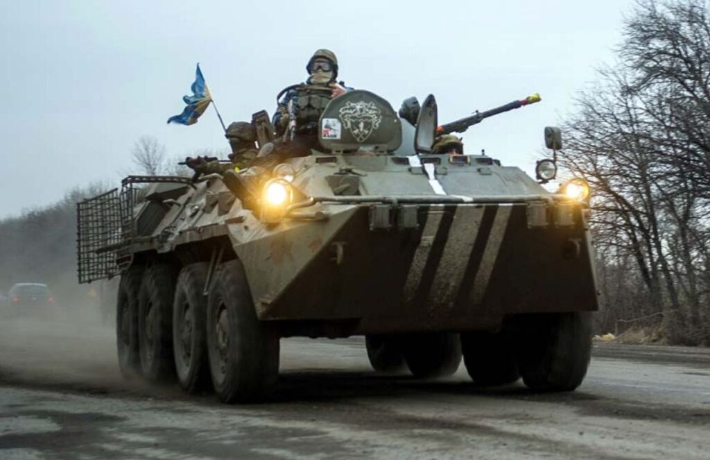 Ukraine gains key ground after five days of intense military operations An armored Ukrainian vehicle with several soldiers outside as they approach their objective