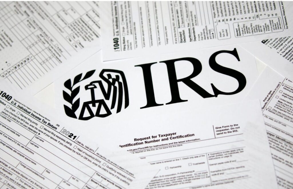 An image of several documents with the United States IRS logo placed on top