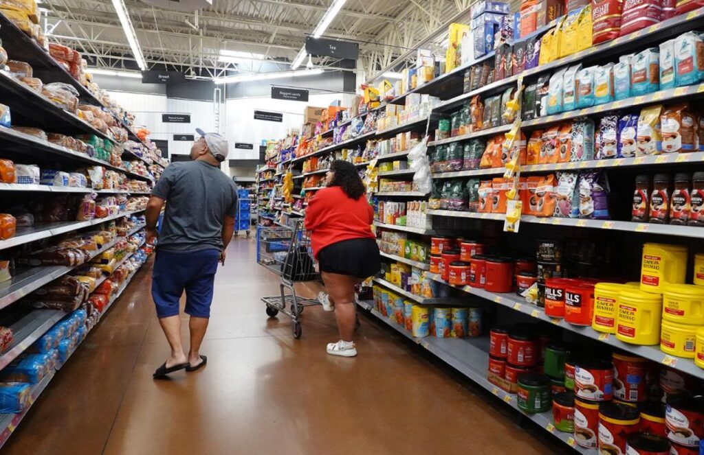 Two people in a supermarket choosing products